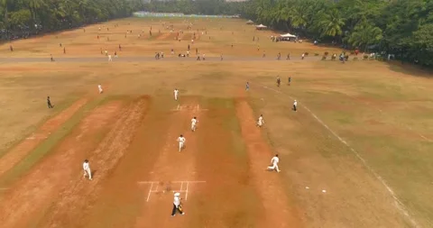 A drone shot of cricket players playing a practice match at the famous Video stock 149554222