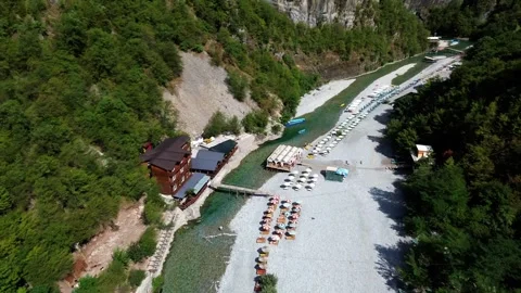 Drone shot of crystal clear blue water flowing through the Shala River vall.. Stock Footage 327199955