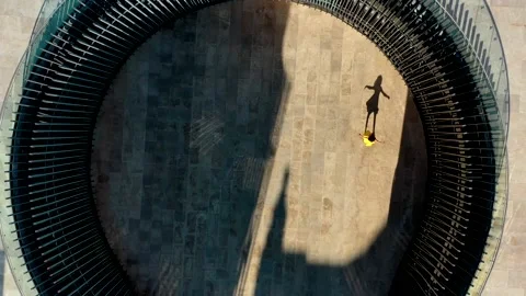 Drone shot of a dancer in a modern building Stock Footage 156655818