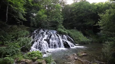 Drone shot of a deep forest waterfall Stock Footage 143938611
