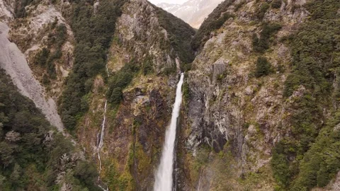Drone shot of Devils Punchbowl Waterfall in Arthurs Pass New Zealand Stock Footage 332957926