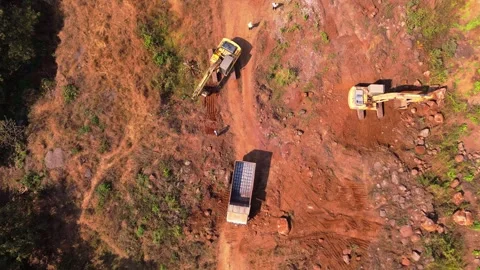 Drone shot diggers along tilt vehicle visible in scene Video stock 297239084