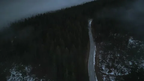 Drone shot of dramatic alpine vista below cloudy skyline Stock Footage 230060626