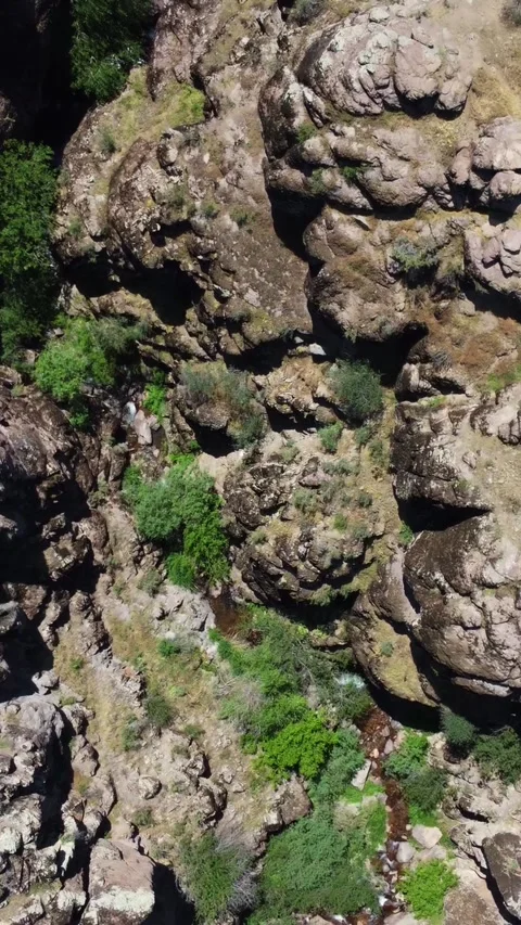 Drone shot of dramatic canyon crevice and volcanic rock plates in Kazakhstan Stock Footage 338124921