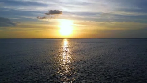 Drone shot of E-foil surfer in the sunset 库存影片 314115622
