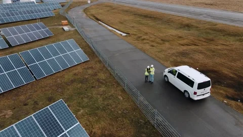 Drone shot of ecological engineers working on a solar panel field Video stock 171968965