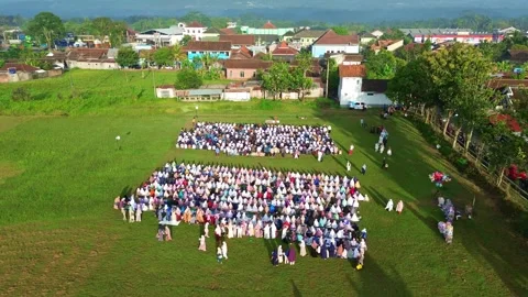 Drone shot of Eid prayer gathering, showcasing unity and devotion across a Video stock 333177554