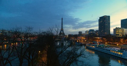 Drone shot of the Eiffel Tower and its surroundings at dusk Stock Footage 101370885