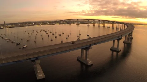 Drone shot of elevated bridge road with cars driving by in early morning. Stock Footage 129062798