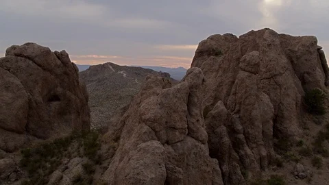 Drone Shot elevating over rocky mountain to reveal landscape Video stock 89556590