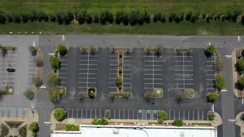 Drone shot of empty parking lot during COVID-19 Stock Footage 128655466