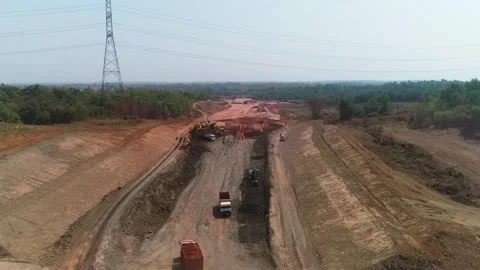 Drone shot of excavator and dump trucks on construction site Stock Footage 346197577