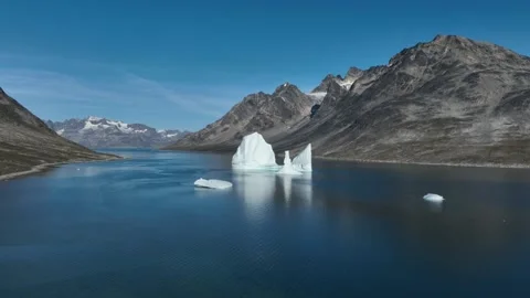 Drone shot of an extremely large iceberg drifting in East Greenland fjord Stock-Footage 332368652