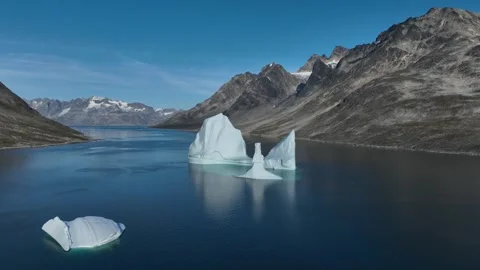 Drone shot of an extremely large iceberg drifting in East Greenland fjord Stock-Footage 332368790