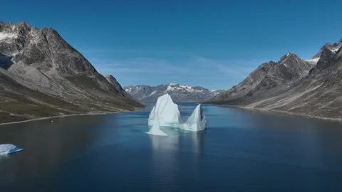 Drone shot of an extremely large iceberg drifting in East Greenland fjord Stock Footage 332368913