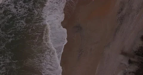 Drone shot facing down of coast and beach Stock-Footage 133544244