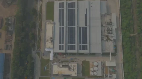 Drone shot factory setup and Solar panel installation in roof top Stock Footage 272407241