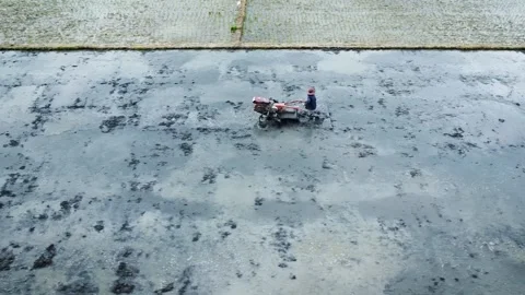 Drone Shot of Farmer Operating Hand Tractor in Flooded Rice Field Video stock 327432123