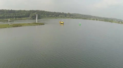 Drone shot of a ferry crossing a river 스톡 동영상 43075411