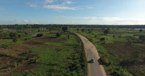 Drone shot of fields, road, and river in Chikwawa, southern Malawi Video stock 245977508