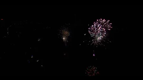 Drone Shot of firework in a city with a lake Vídeo Stock 248971487