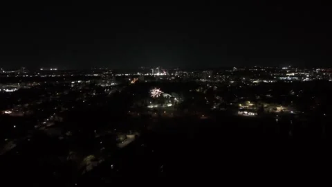 Drone shot of fireworks being shot off in a park at night in Ontario, Canada on Stock Footage 336130807