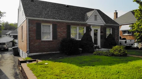 Drone shot flies up and over a suburban house Stock-Footage 130144598