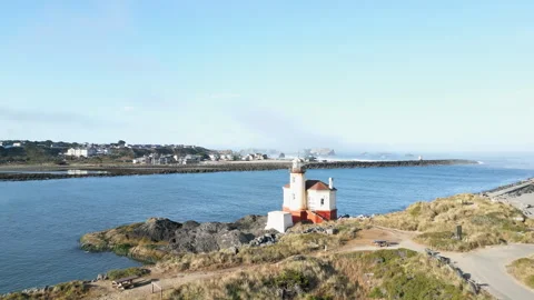 Drone shot flies over a lighthouse along the Coquille river Stock Footage 251756262