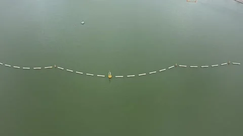 Drone shot of Floating barriers at Marina Barrage, Singapore Stock Footage 151566899