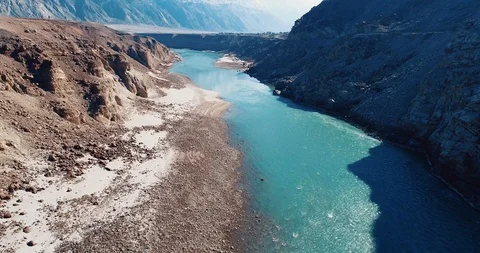 Drone shot of flowing river bank with beautiful mountain ranges. Stock Footage 123899341