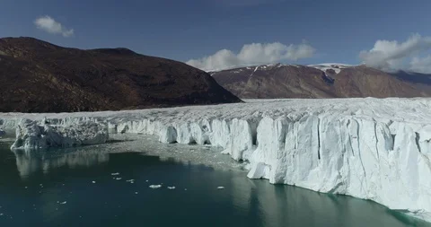 A Drone Shot Flying Up and Over a Glacier Passing Close To Ice Stock Footage 96044572