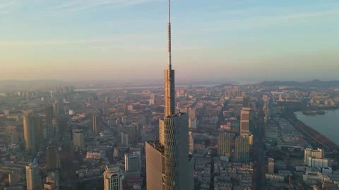 Drone shot-flying down and tilt up towards a tall building 動画素材 255018518
