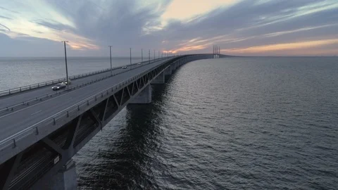 Drone shot flying down next to Øresund Bridge at dusk Stock Footage 112065395