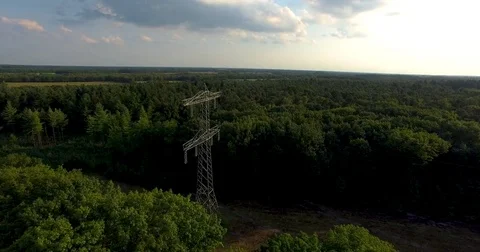 Drone shot flying over an antenna in a forest Video stock 79664590