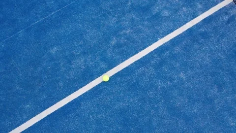 Drone shot flying over a blue padel court with balls recreation and leisure.. Vídeo Stock 314448245