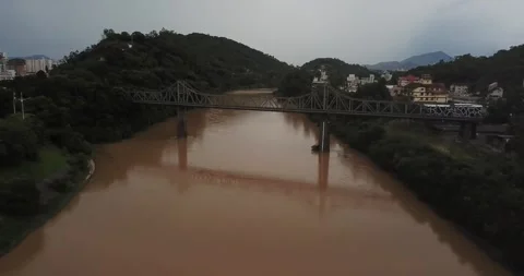 Drone shot flying over bridge on Itajaí-Açu River, Blumenau, Santa Catarina Stock Footage 317735872