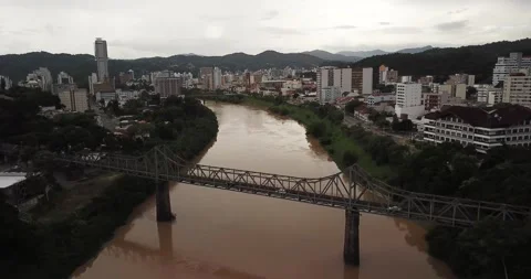 Drone shot flying over bridge on Itajaí-Açu River, Blumenau, Santa Catarina Stock Footage 317736030