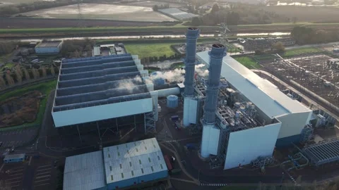 Drone shot flying over a large CCGT gas powered station generating for the Stock Footage 336323261