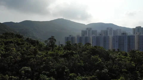 Drone Shot Flying Over Mountain Towards City Video stock 184116816
