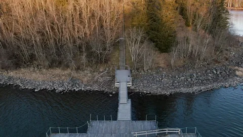 Drone shot flying over pier and trees Stock Footage 124030784