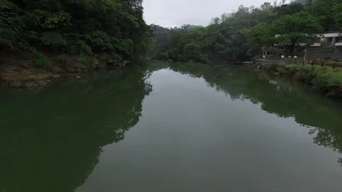 Drone shot flying over river and waterfall Stock Footage 85813835