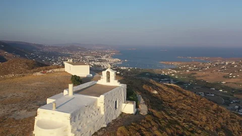 Drone shot flying over small whitewashed church in Greek Island of Paros Stock-Footage 121801659