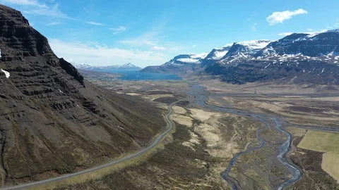 Drone shot flying over a valley and fjord in Iceland Stock Footage 112435898