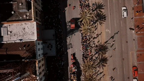 Drone shot flying through downtown New Orleans over Parade. Stock Footage 88553794