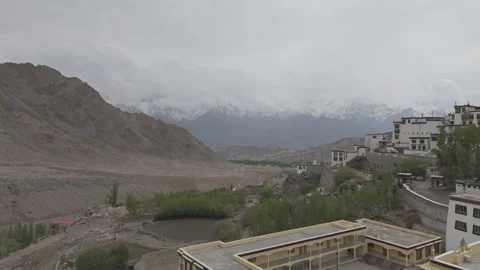 Drone Shot Flying Through Ladakh Monastery Toward Snow Covered Mountains in the Stock Footage 334656900