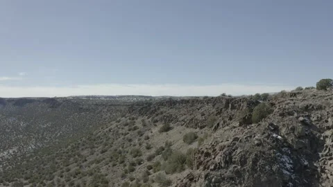 Drone shot flying toward remote mountainous landscape after a snow dusting Video stock 167672309