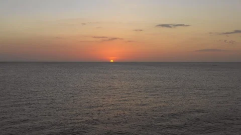 Drone shot flying towards the sun over Pacific ocean at sunset. Costa Rica. Stock Footage