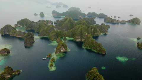 Drone shot following over a cliffs and lagoons with turquoise water  Stock Footage 260020853