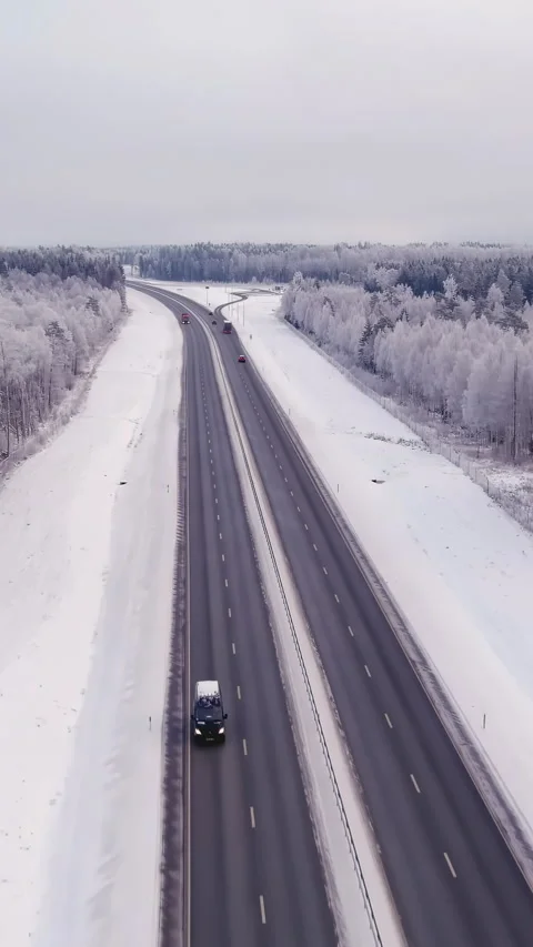 Drone shot of a four lane highway in Estonia during wintertime. Stock Footage 340435434