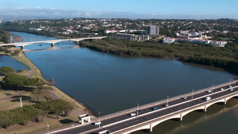 Drone shot of freeway over the Umgeni River to mangroves and wetlands Stock Footage 240182225